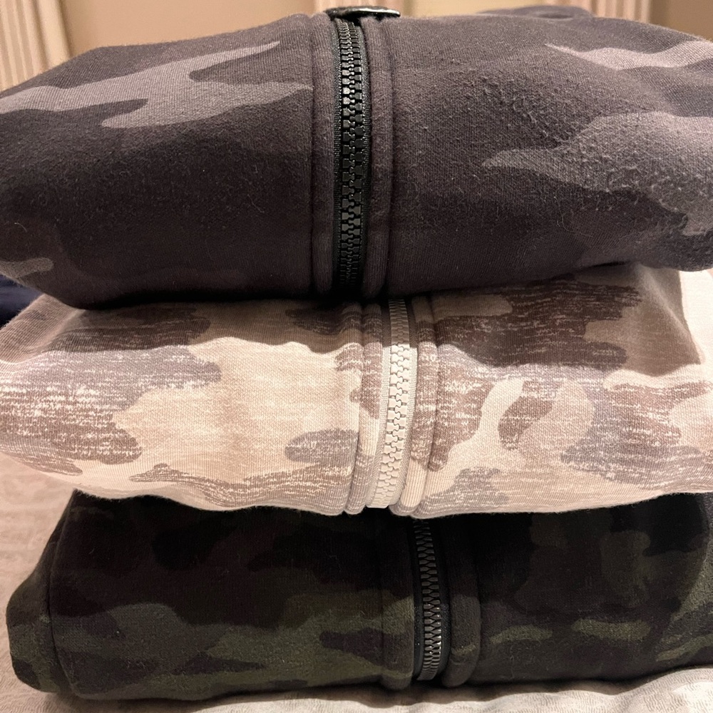 Three camo hoodies. Two Athleta size small. One lululemon size 6. Sold as bundle